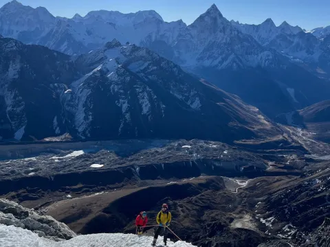 Climbers climbing Lobuche East Peak with fixed rope during the summit ascent