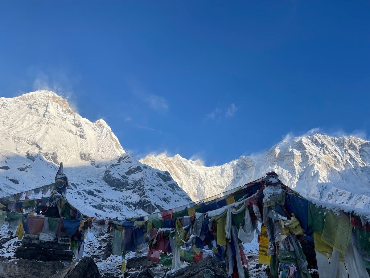 Annapurna Base Camp with prayer flags and Annapurna I (10th highest mountain)