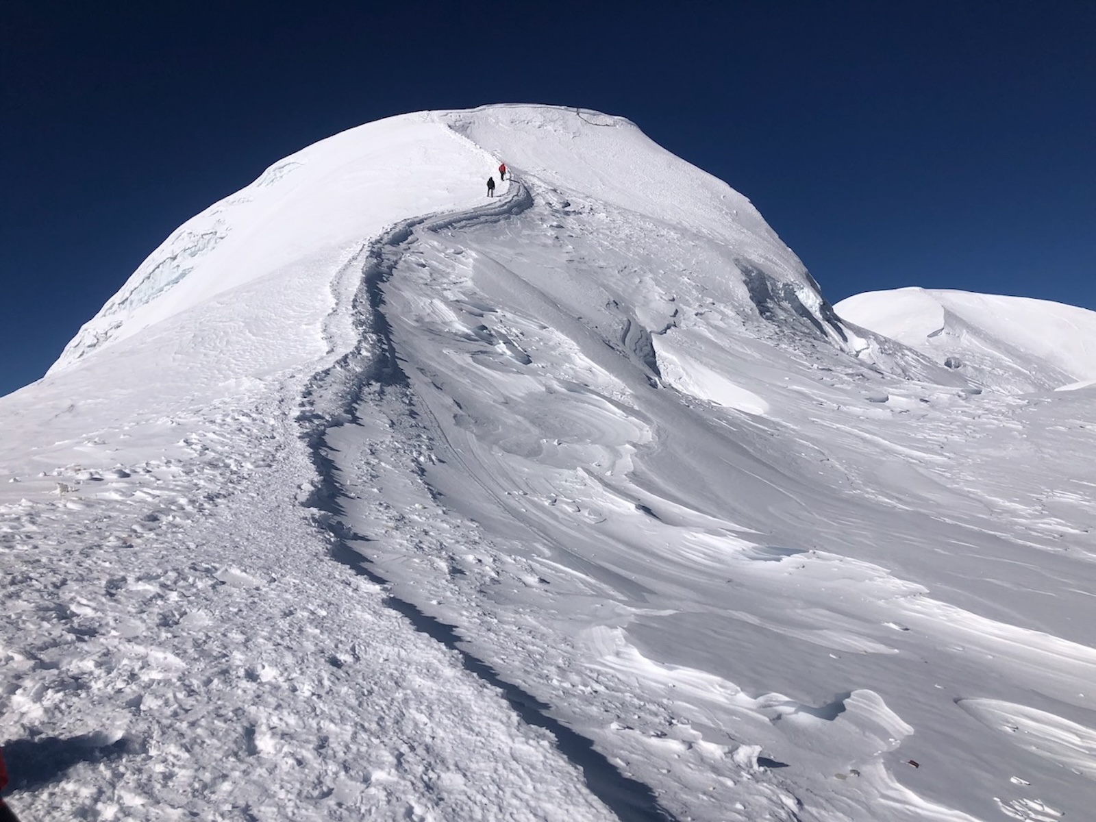 Snow-covered ridgeline near the summit of Mera Peak during the climbing